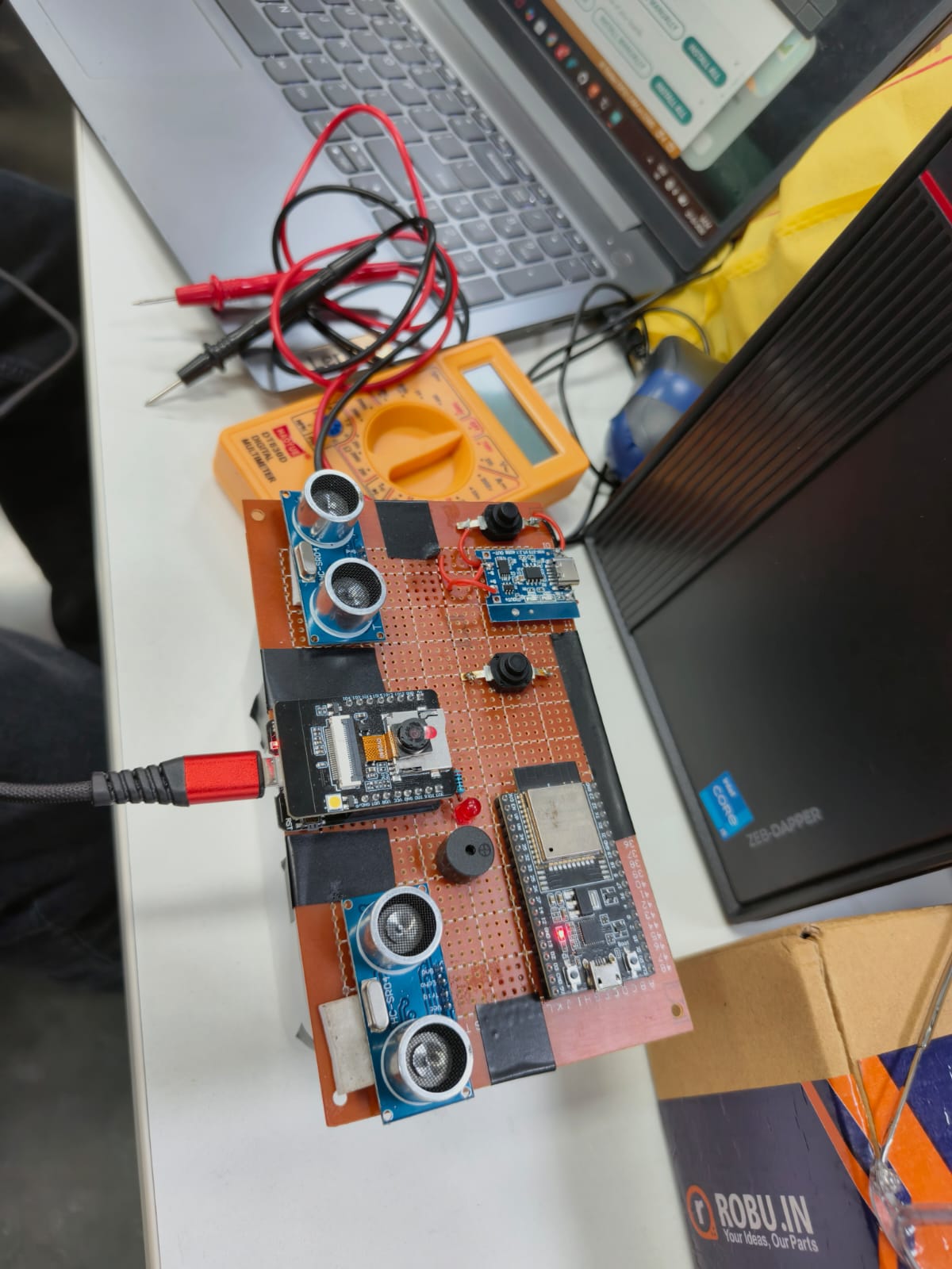 Messy workbench with hardware setup